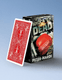 A deck of playing cards with a red back design leaning against its black retail box, which reads 'Knock 'Em Dead' and 'Peter Nardi'.